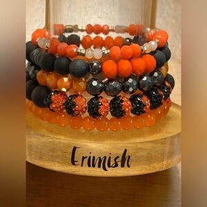 Erimish Orange and Black Mixed Bead Stack Bracelet Set and Bracelet stand.